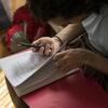 Person looking at a printed theater script. 