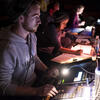 students working behind the scenes of a news broadcast