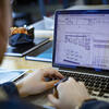student working on architecture software on their laptop.