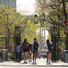 students walking on main campus on a sunny spring day