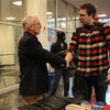 Engineering management certificate student shaking hands with faculty