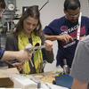 Mechanical engineering students collaborating in class