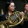 Two Temple University Boyer College of Music and Dance students play the french horn.